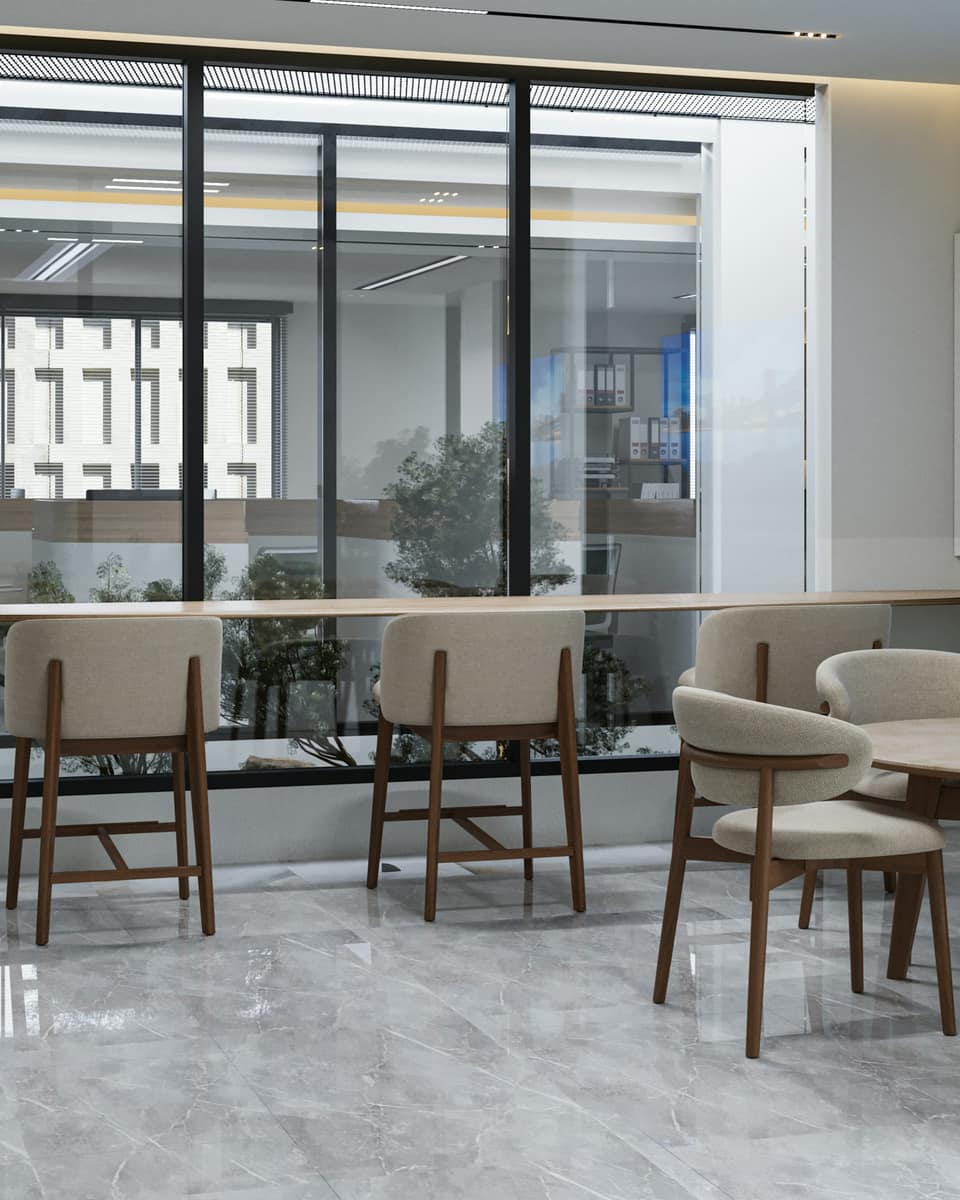 Bright meeting lounge with a marble floor and wooden chairs
